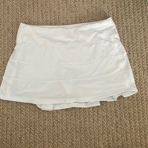 A white Lululemon Pace Rival (regular) skirt.